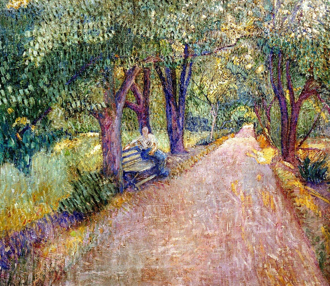 A park view with green trees rows and a woman sitting on the bench on the left.